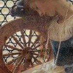 Young Irish woman at a spinning wheel to illustrate the traditional Irish song  The Spinng Wheel Song